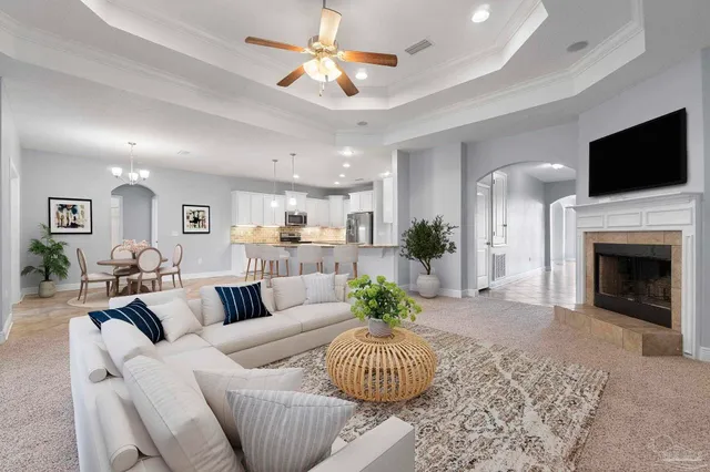 a living room with furniture fireplace and a flat screen tv