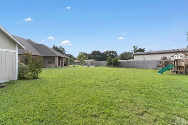 a front view of house with yard and outdoor seating