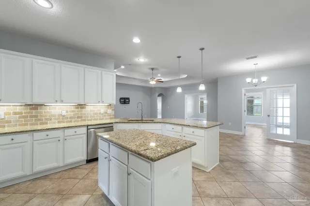 a kitchen with a sink and cabinets
