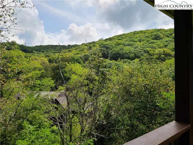 a view of a balcony with chairs