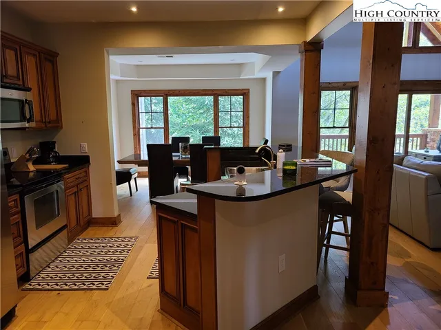 a kitchen with a sink and living room