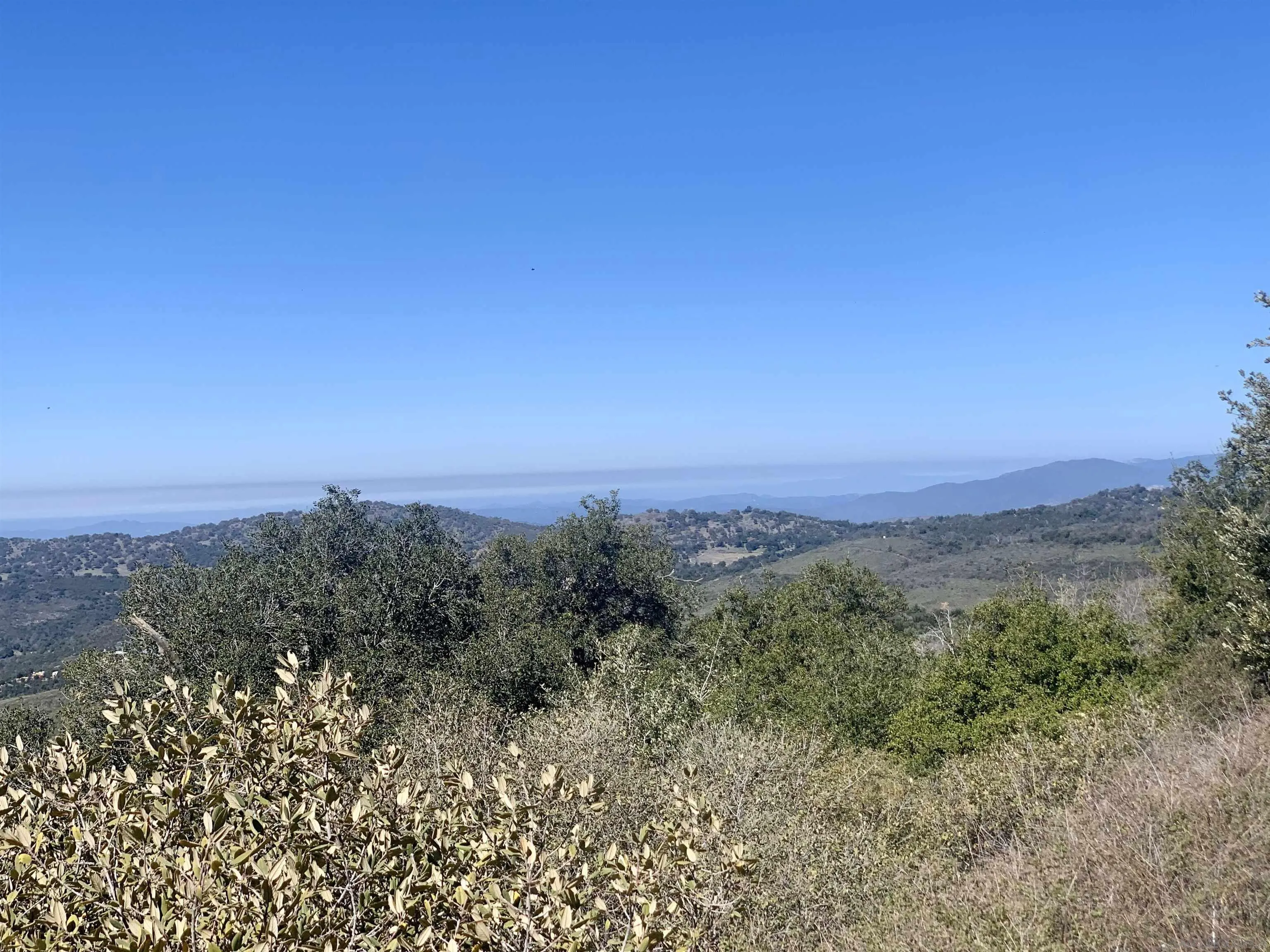 5253 Acorn Patch Road Julian, CA 92036 - Photo 16 of 18 a view of a city and mountains in the background