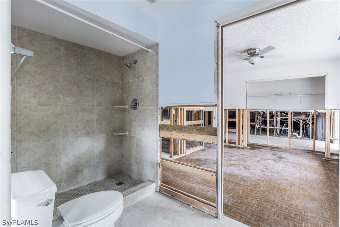 591 Boulder Drive Sanibel, FL 33957 - Photo 28 of 29 a bathroom with a toilet sink and shower