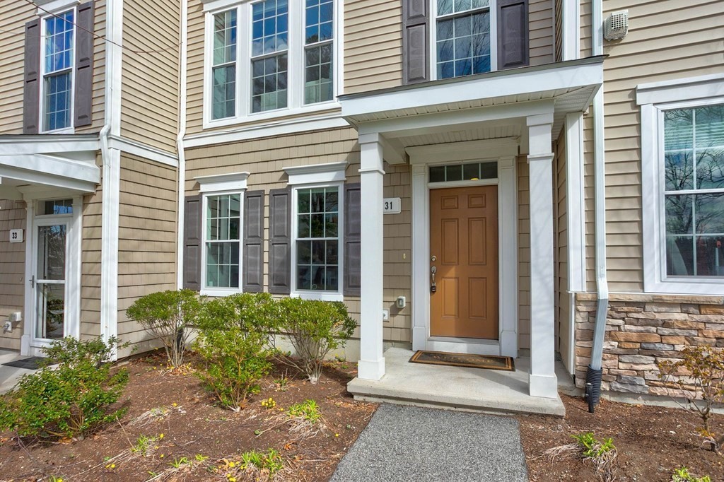 a view of a brick house with front door