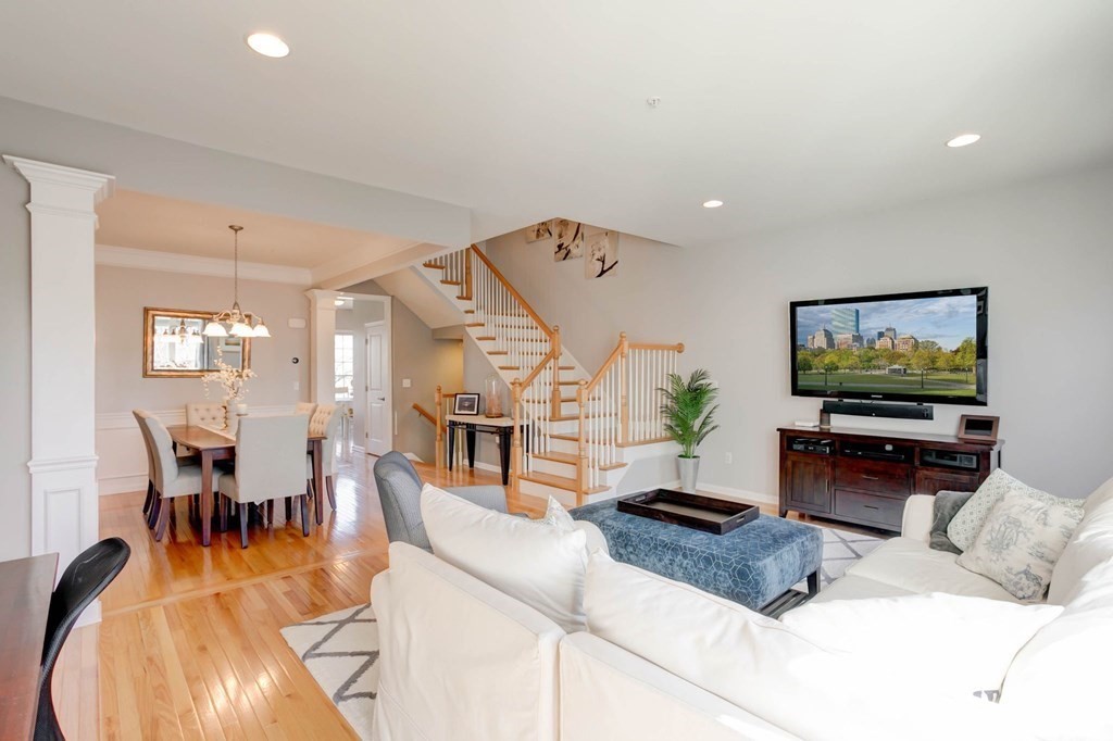 31 Jacob Way, Unit 31 Reading, MA 01867 - Photo 11 of 42 a living room with furniture and a flat screen tv