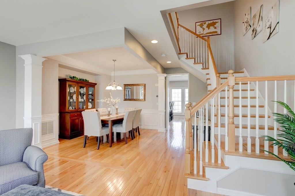 31 Jacob Way, Unit 31 Reading, MA 01867 - Photo 15 of 42 a dining room with wooden floor and furniture