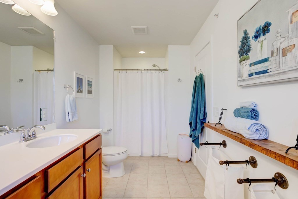 31 Jacob Way, Unit 31 Reading, MA 01867 - Photo 31 of 42 a bathroom with a sink double vanity and a shower