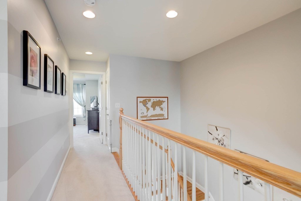 31 Jacob Way, Unit 31 Reading, MA 01867 - Photo 33 of 42 a view of a hallway with windows