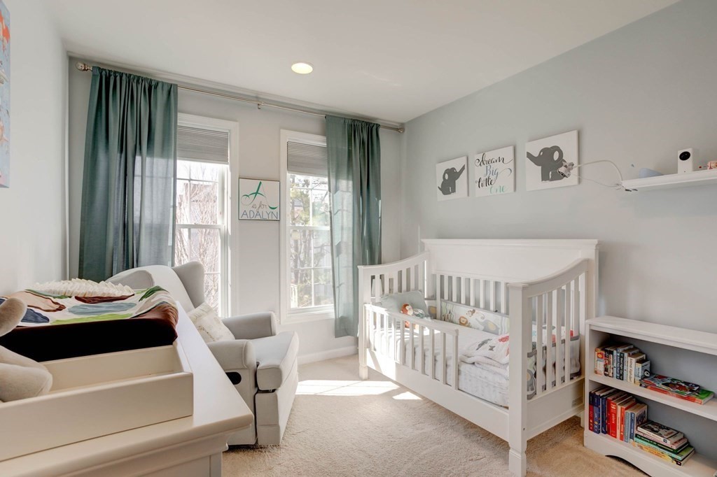 31 Jacob Way, Unit 31 Reading, MA 01867 - Photo 34 of 42 a bedroom with furniture and a window