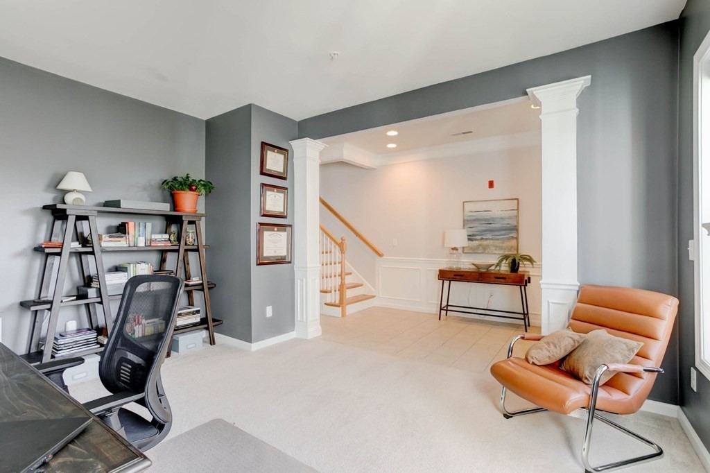 31 Jacob Way, Unit 31 Reading, MA 01867 - Photo 8 of 42 a livingroom with furniture and a gym equipment