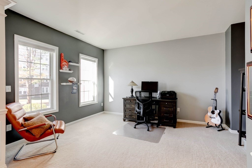 31 Jacob Way, Unit 31 Reading, MA 01867 - Photo 9 of 42 a view of a livingroom with workspace and a window