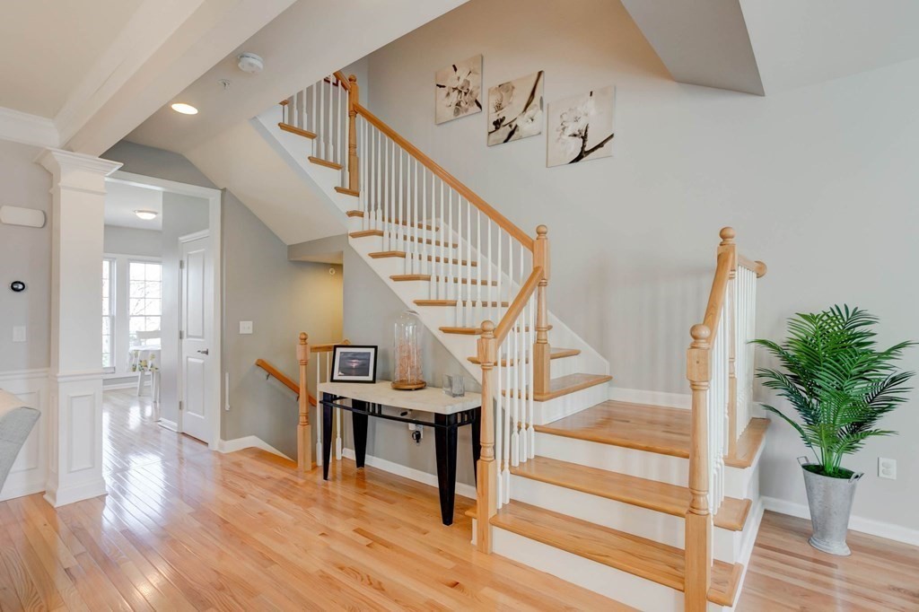 31 Jacob Way, Unit 31 Reading, MA 01867 - Photo 10 of 42 a view of entryway and hall with wooden floor