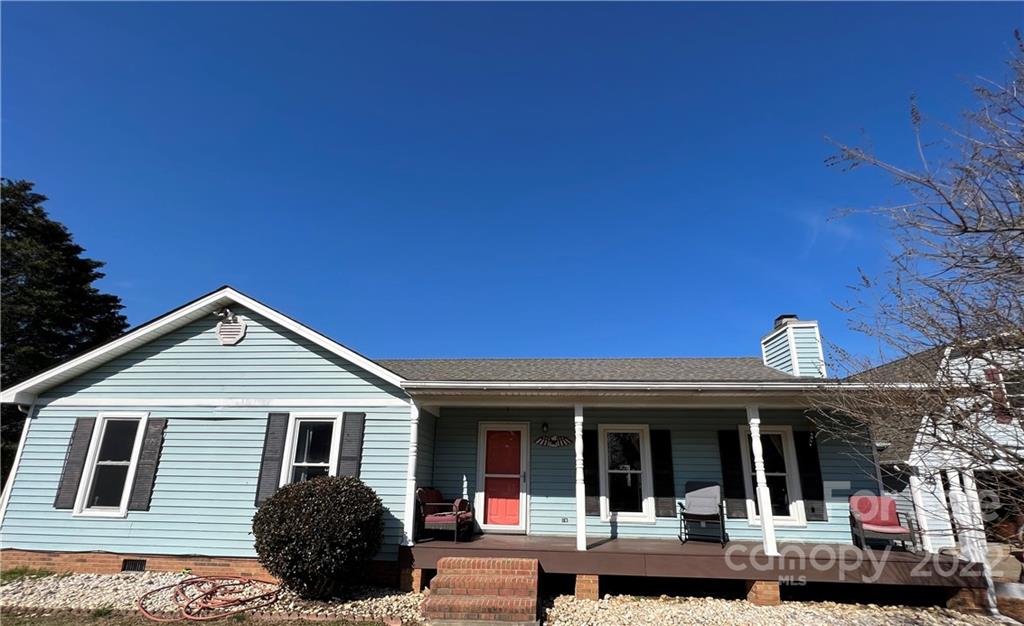 3601 Austin Road Monroe, NC 28112 - Photo 1 of 26 a view of a house with a small yard and potted plants