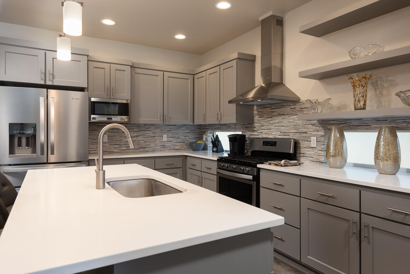 62011 Dantili Road Bend, OR 97701 - Photo 4 of 25 a kitchen with stainless steel appliances a sink stove and refrigerator