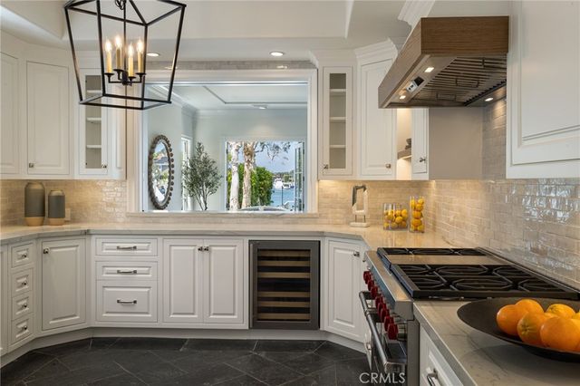 a kitchen with stainless steel appliances granite countertop a stove and a sink