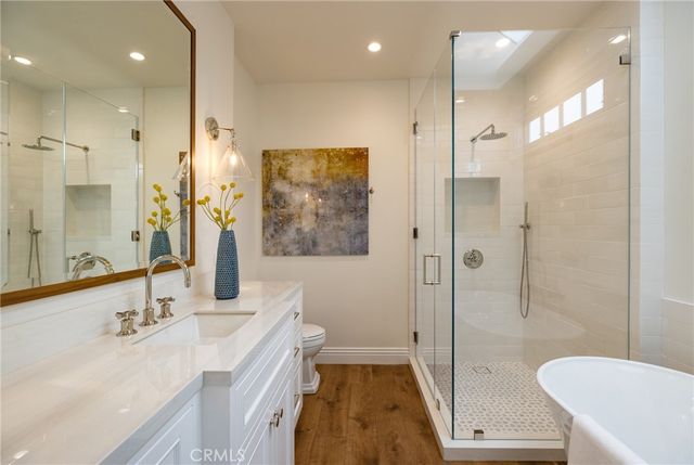 a bathroom with a tub and a sink