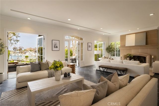 a living room with furniture wooden floor and a fireplace