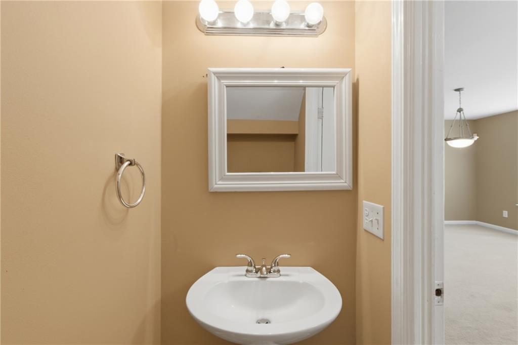 1081 Estes Drive Southwest, Unit 504 Atlanta, GA 30310 - Photo 11 of 32 a bathroom with a sink and a mirror