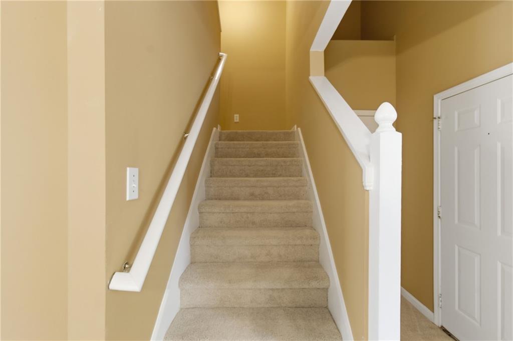 1081 Estes Drive Southwest, Unit 504 Atlanta, GA 30310 - Photo 13 of 32 a view of staircase with white walls and white door
