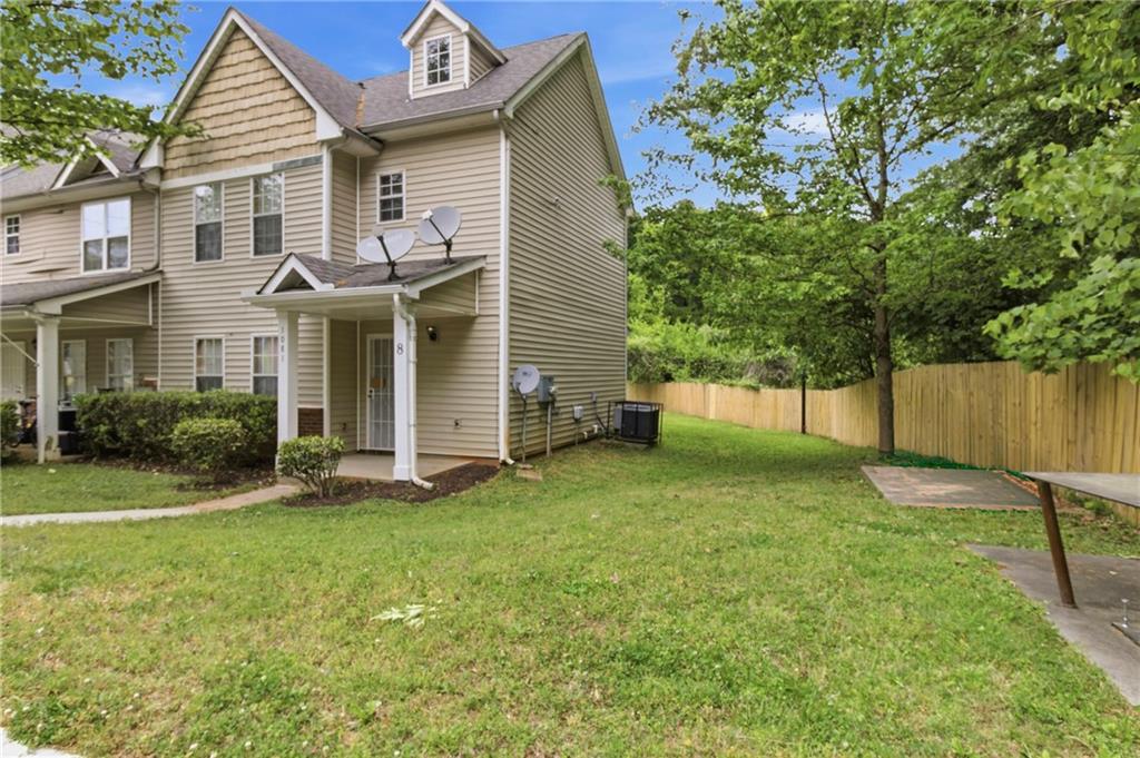 1081 Estes Drive Southwest, Unit 504 Atlanta, GA 30310 - Photo 2 of 32 a front view of a house with a yard