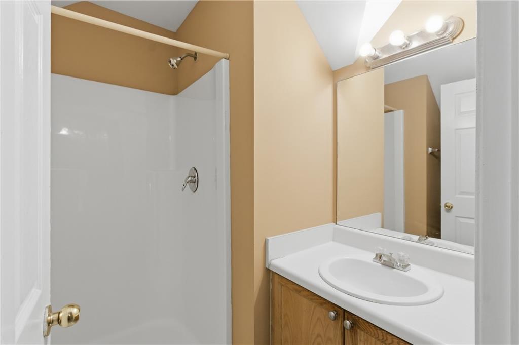 1081 Estes Drive Southwest, Unit 504 Atlanta, GA 30310 - Photo 25 of 32 a bathroom with a sink and a mirror