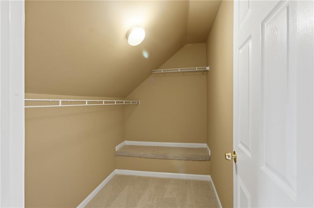 1081 Estes Drive Southwest, Unit 504 Atlanta, GA 30310 - Photo 29 of 32 a view of walk in closet with empty racks