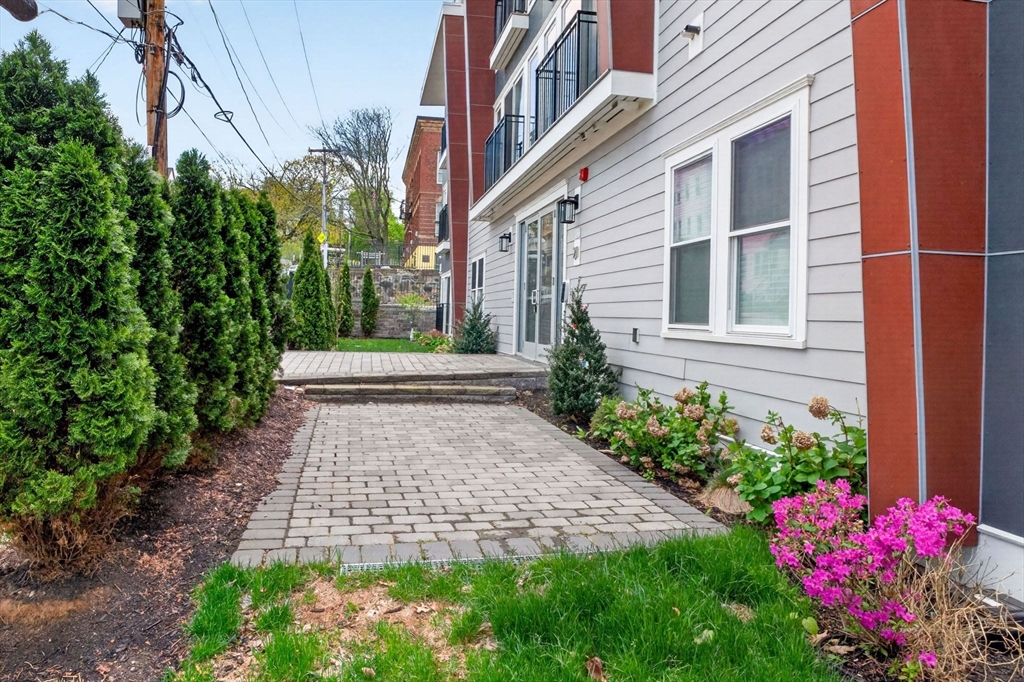 21 Glen Road, Unit 10 Boston, MA 02130 - Photo 19 of 26 a view of a pathway both side of the house