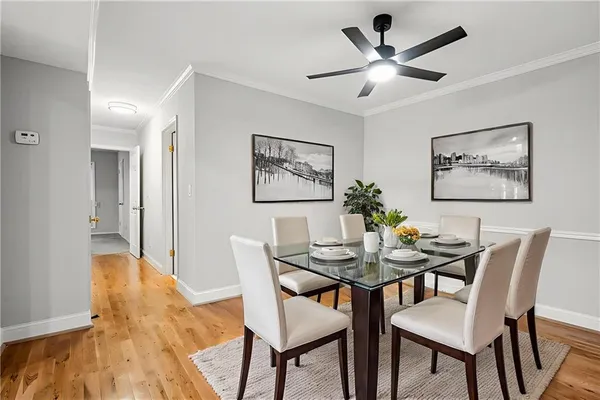 a dining room with furniture and window