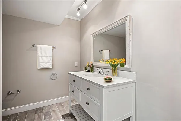a bathroom with a sink and a mirror