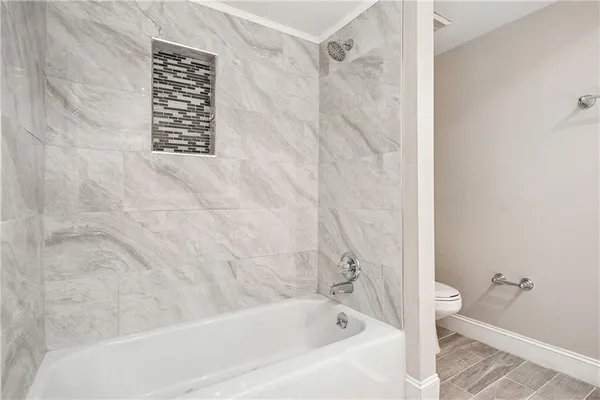 a bathroom with a bathtub and a shower