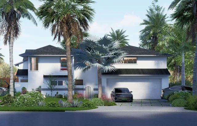 a front view of multiple houses with yard