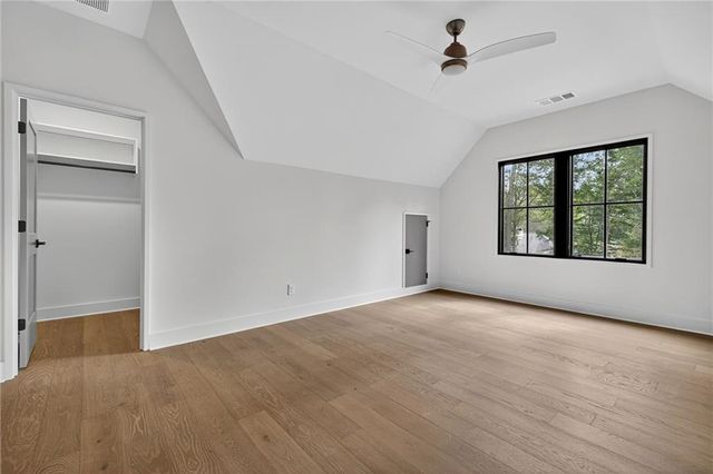 a kitchen with granite countertop cabinets stainless steel appliances and a counter space
