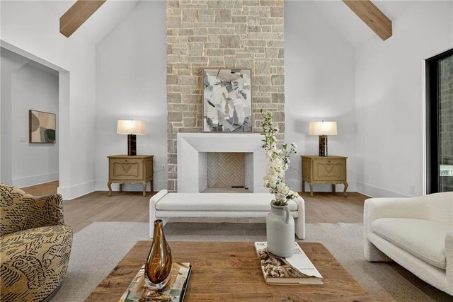 a living room with furniture and a ceiling fan