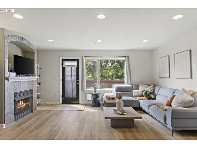 a kitchen with stainless steel appliances a stove a sink and a refrigerator