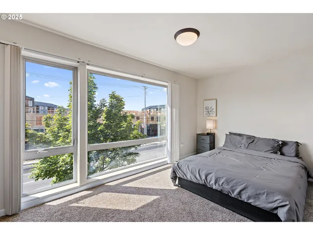 a bedroom with a bed and cabinets