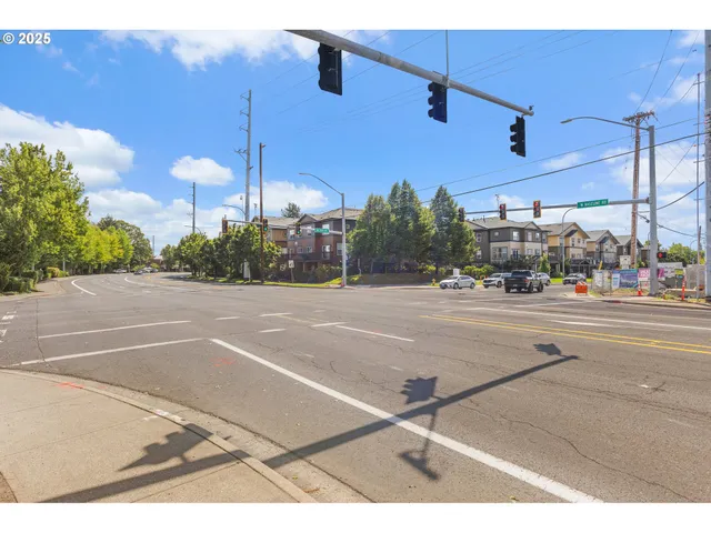 a view of a street with a building in the background