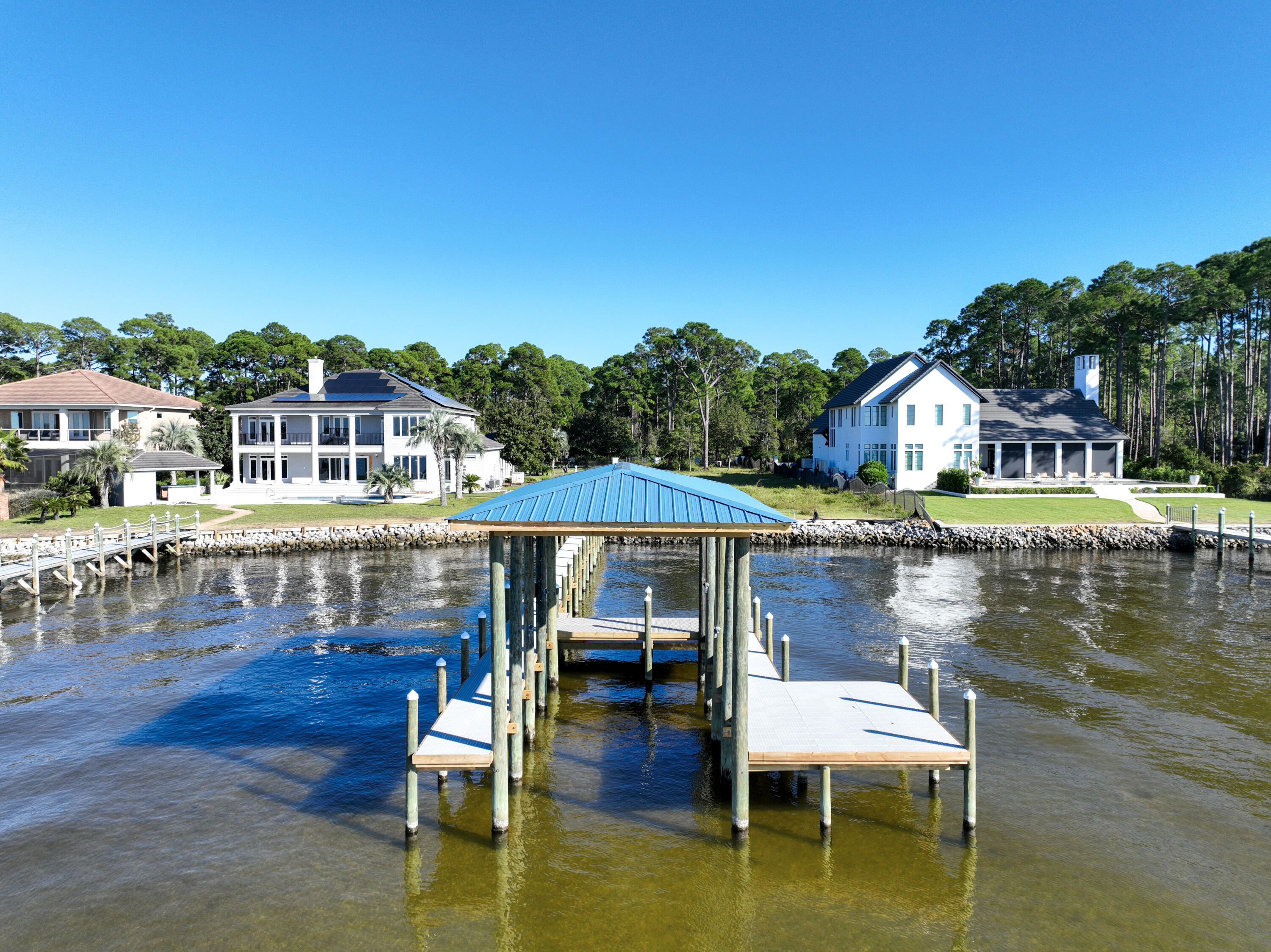 643 Driftwood Point Road Santa Rosa Beach, FL 32459 - Photo 6 of 17 a white house with swimming pool in front of it