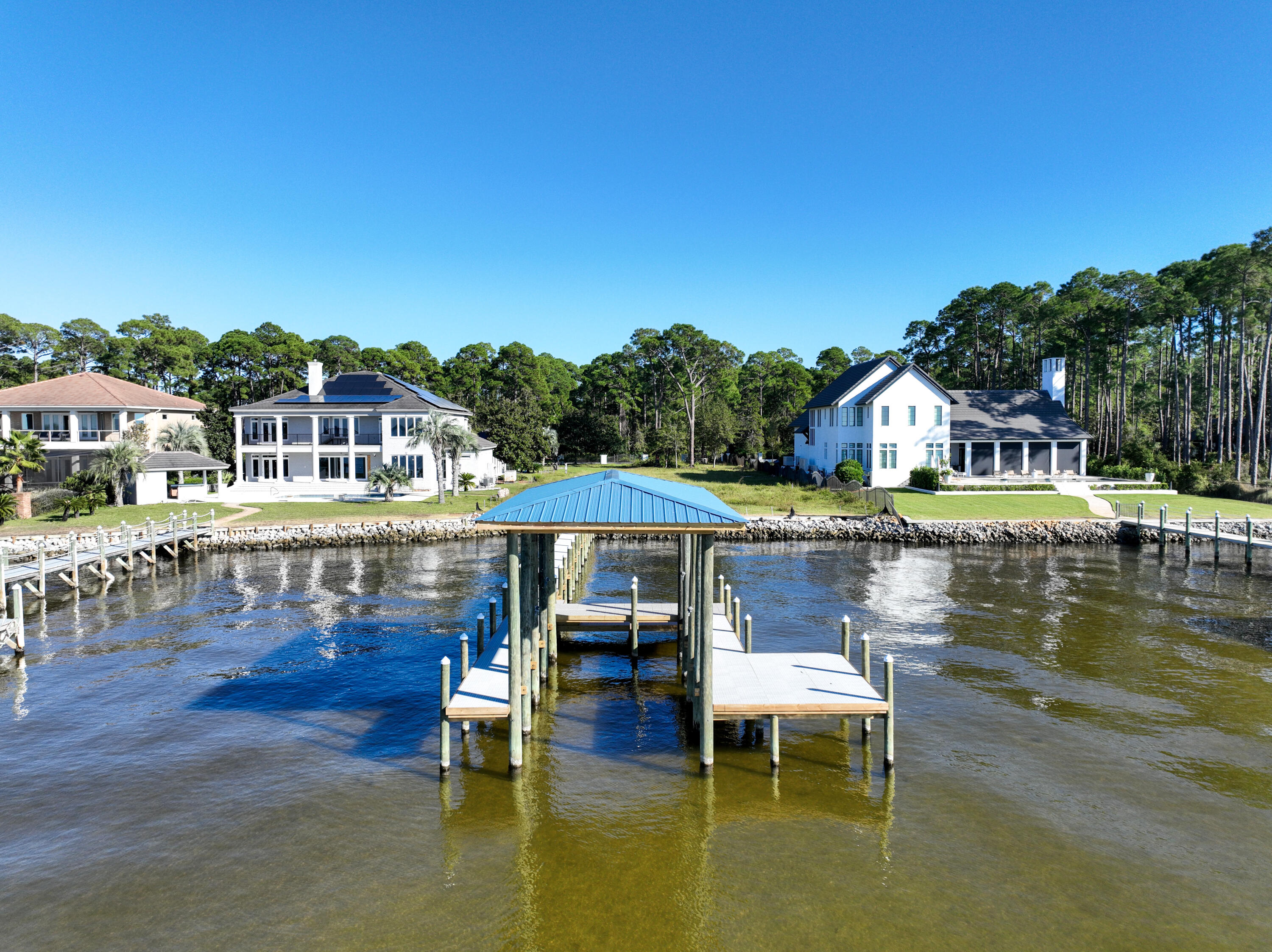 643 Driftwood Point Road Santa Rosa Beach, FL 32459 - Photo 7 of 17 a small pool with lawn chairs under an umbrella