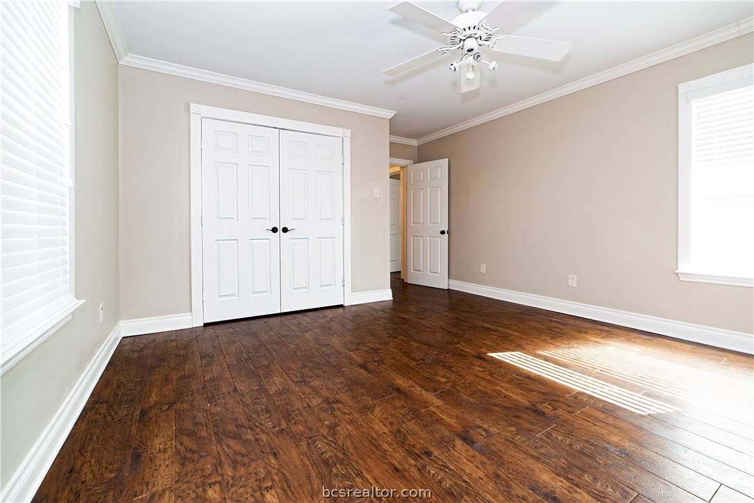 7654 County Road 121 Wharton, TX 77488 - Photo 15 of 39 a view of an empty room with wooden floor and a window