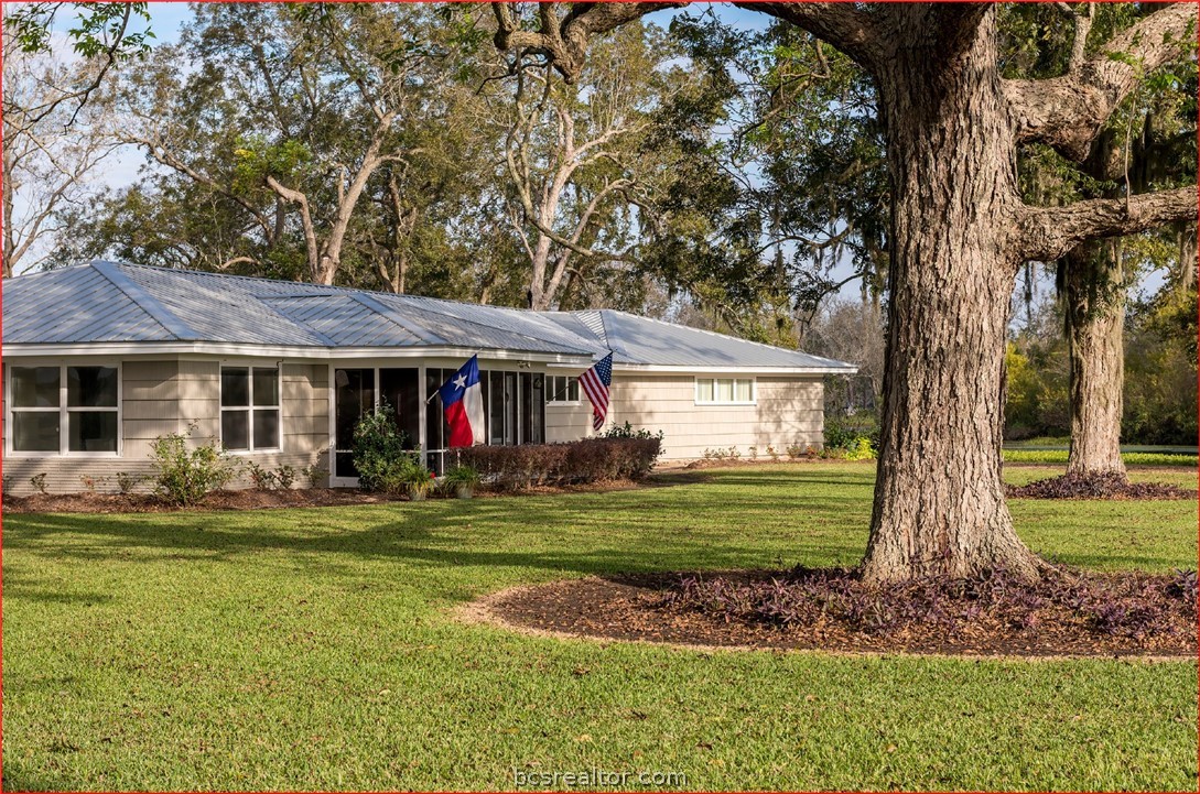 7654 County Road 121 Wharton, TX 77488 - Photo 5 of 39 a view of a house with a yard balcony and sitting area