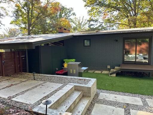 3322 Ocotea Street Raleigh, NC 27607 - Photo 29 of 34 a backyard of a house with barbeque oven