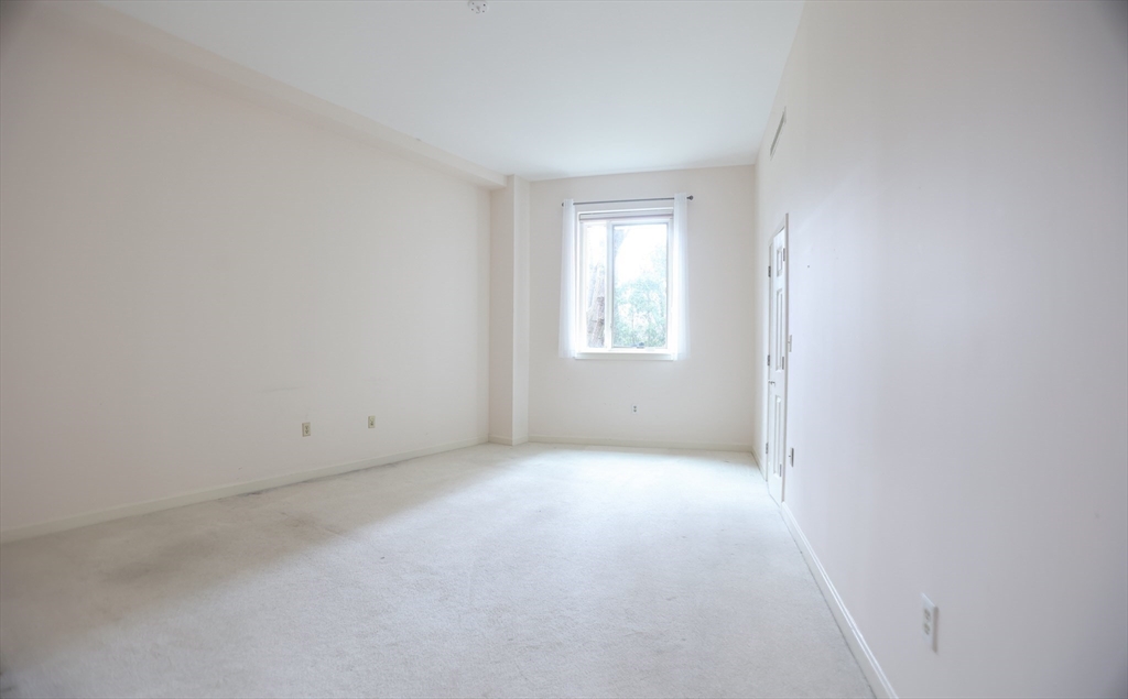 100 Keyes Road, Unit 220 Concord, MA 01742 - Photo 12 of 23 an empty room with windows
