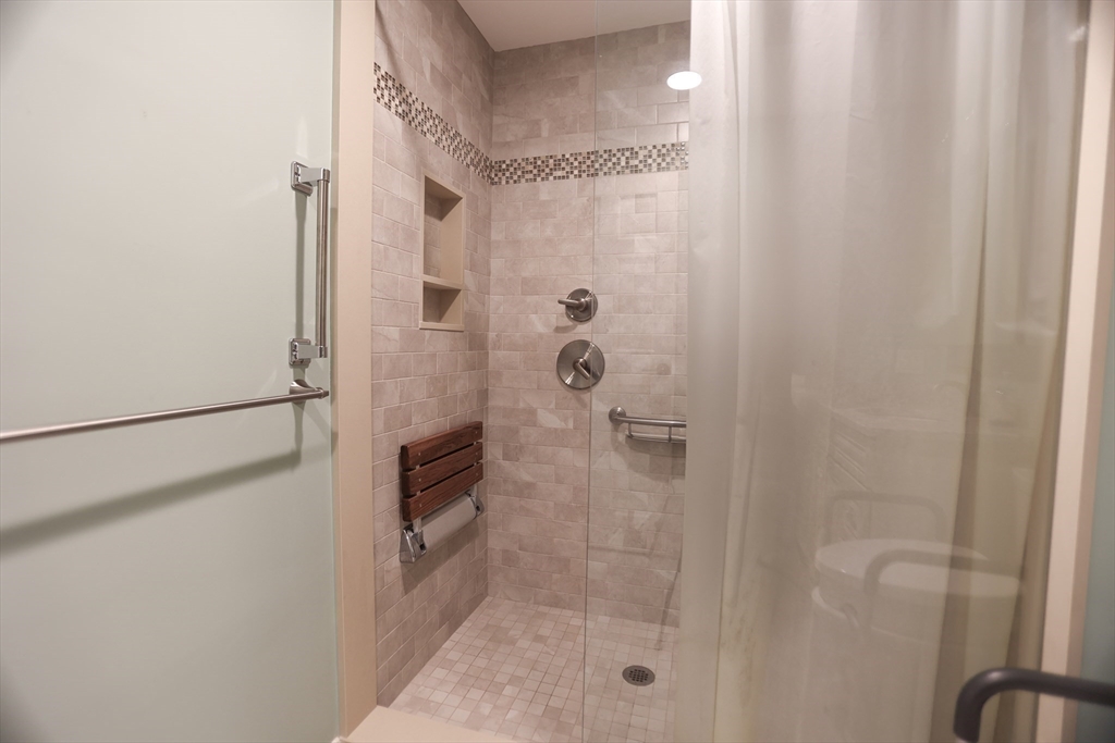 100 Keyes Road, Unit 220 Concord, MA 01742 - Photo 15 of 23 a bathroom with a shower