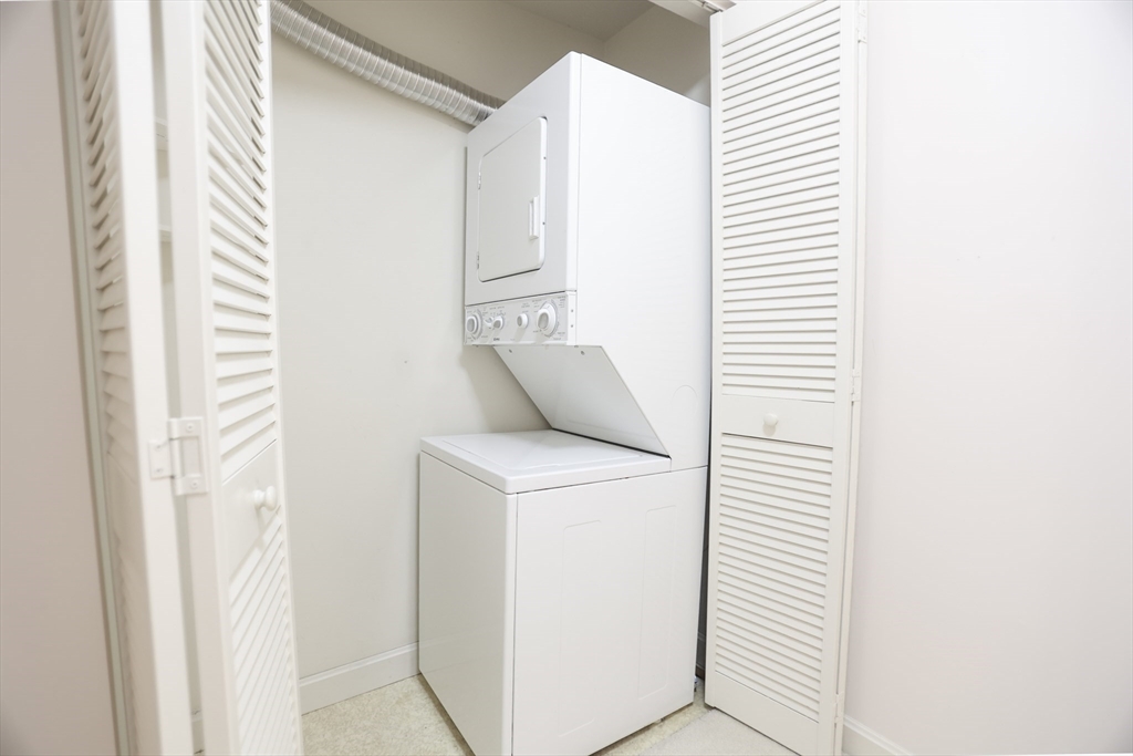 100 Keyes Road, Unit 220 Concord, MA 01742 - Photo 19 of 23 a utility room with dryer and washer