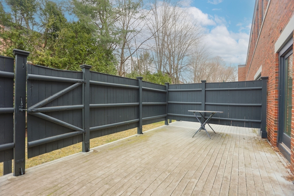100 Keyes Road, Unit 220 Concord, MA 01742 - Photo 2 of 23 a view of outdoor space with wooden floor and windows