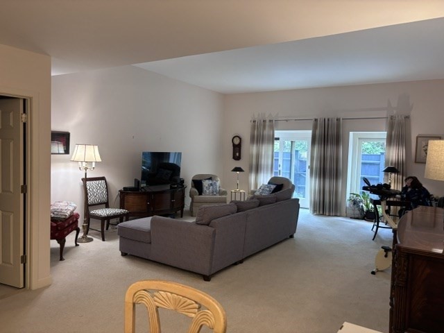 100 Keyes Road, Unit 220 Concord, MA 01742 - Photo 4 of 23 a living room with furniture and a lamp