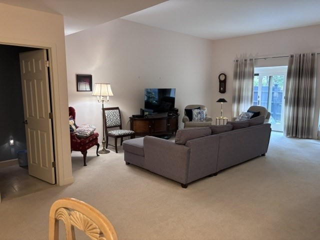 100 Keyes Road, Unit 220 Concord, MA 01742 - Photo 5 of 23 a living room with furniture and a flat screen tv