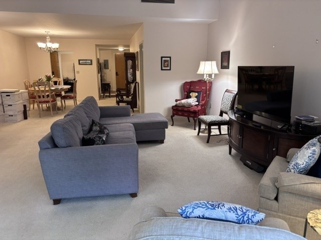 100 Keyes Road, Unit 220 Concord, MA 01742 - Photo 6 of 23 a living room with furniture and a flat screen tv