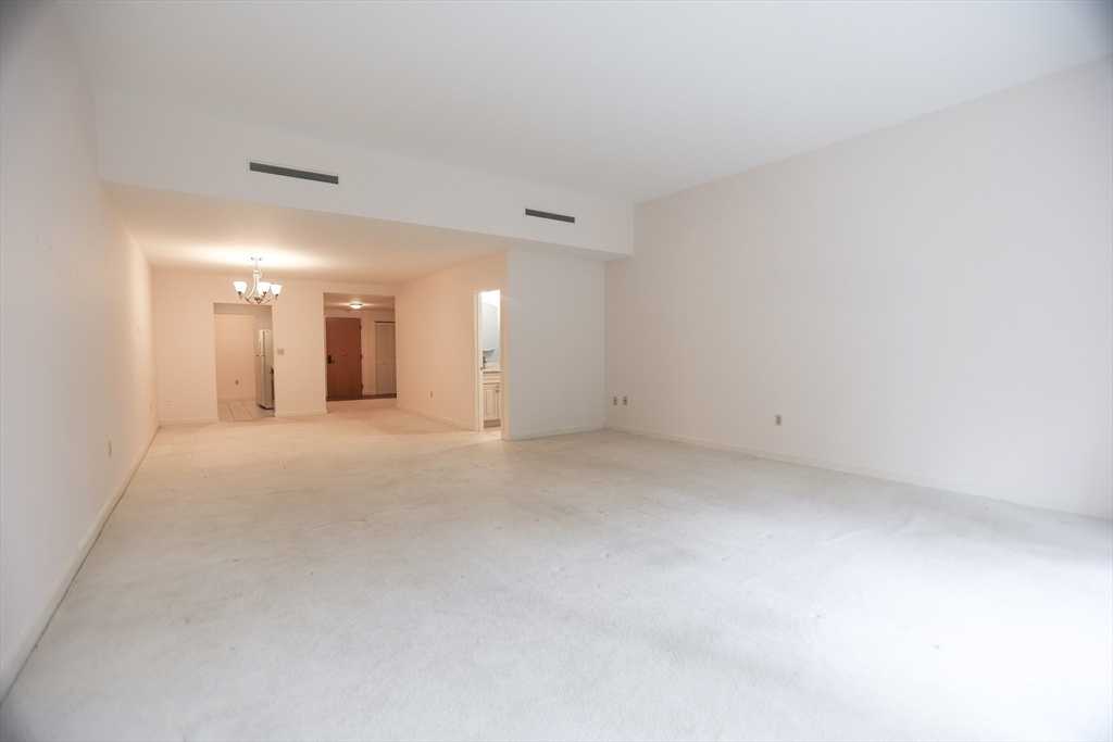 100 Keyes Road, Unit 220 Concord, MA 01742 - Photo 8 of 23 a view of a big room with a kitchen