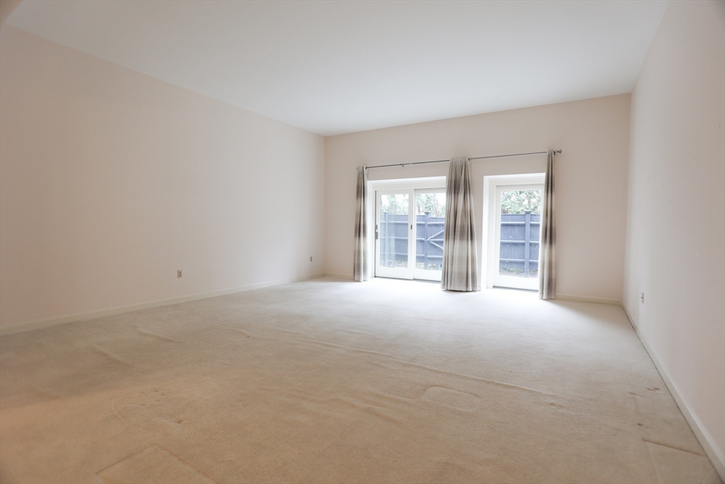 100 Keyes Road, Unit 220 Concord, MA 01742 - Photo 9 of 23 an empty room with windows